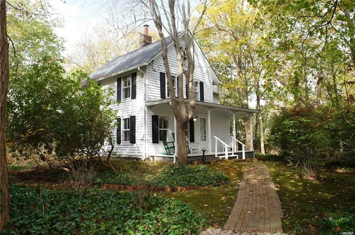 Pituresque Victorian located in walking distance to the quaint town of Center Moriches. This home boasts 3br, full bath, eik w/fp, half bth, lr, dr w/built ins and fam room, 2 cr gar and attic. Set back from the road and surrounded by beautifully landscaped grounds. A must see!