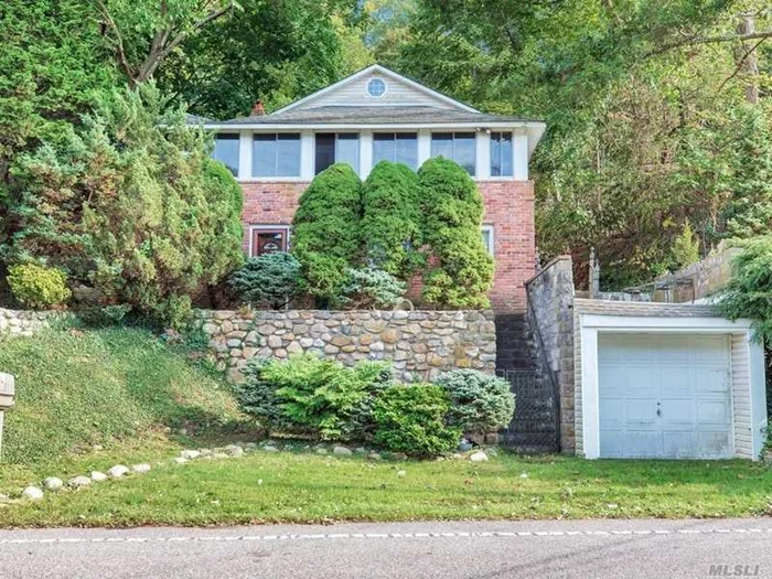 Att: Investors, Contractors and HGTV Remake Lovers. Brick Beach side cottage with wraparound enclosed porch. Fabulous location-steps to Fleets Cove Beach with expansive pondview of neighbor house across street. Full unfinished (raw) above ground basement- 1 car detached garage. Tremendous unrealized charm but needs a lot of work and love.Windows and roof- 7 years old .Gas heat.Great summer home, rental or simple small living. Sold AS IS-Seller prefers CASH but conventional mortgage ok