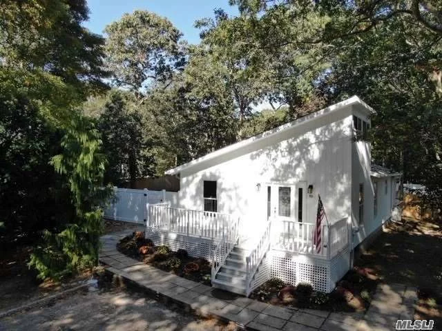 Lovely home nestled in the heart of East Hampton. Located a mile from the East Harbor. This renovated 2 bed- 2 bath home is the perfect East End sanctuary. New baths, kitchen w/ SS appliances & quartz counters. Vaulted ceilings & hardwood floors, portray a large open living space. Open den w/ wood burning stove and blue stone floor . New windows skylight brings plenty of natural light throughout. New roof. Enjoy the holidays, wooden deck & IG pool w/ new liner, filter & pump. Turn key ready