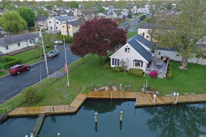 Beautiful Waterfront Home with 120&rsquo; of Bulkheading, 6 Dock Slips, Large Detached 2-Car Garage W/Workshop, 3 Bedrooms, 2 Full Baths, Lovely Kitchen, LR, Den...All on Private, Quiet Dead-End Location, $700 Fema Flood. Spacious Living.