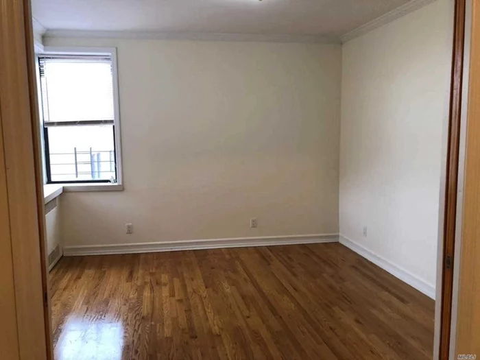 Beautifully renovated Junior one apartment in the heart of Flushing, with hardwood floor thru-out, laundry in the building. close to all! *Advertised is Net Effective Rent.*