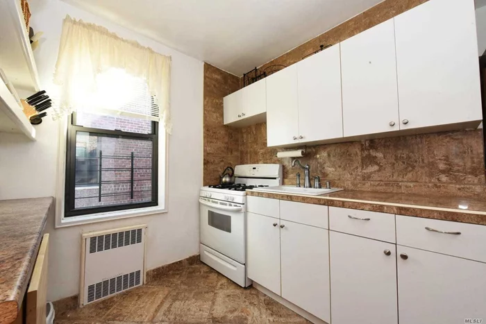 Updated 2 bedroom jr 4 apartment on the top floor with hardwood floors. Doorman building, laundry and bicycle room at premises.Facing Queens Boulevard.Just a few blocks away from E and F Van Wyck- Briarwood station. Close to supermarkets, stores and much more.
