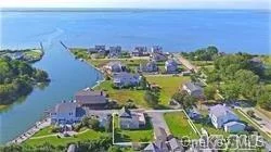 Enjoy Beautiful Waterviews & Watching The Sunrise From This Dreamy Beach House W/Your Own Dock Featuring A New Eat In Kitchen W/Marble Counter Tops, New Wide Plank Wood Floors, New Ductless A/C And Heat, Updated Electric, New Windows & Roof, Full Basement, 1.5 Car Detached Garage. Very low, Transferable flood insurance. Feel like your on vacation year round.