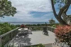 Spectacular Waterfront Residence Overlooking Smithtown Bay And The LI Sound With 160FT Of Water Frontage. Many Updates Including A Gourmet Modern Kitchen With Every Amenity, Family Room With Fireplace And Walls Of Windows, Formal Dining Room, 5 BR, 4.5 Baths, Upstairs Den With Deck, Sunroom, Large Master BR Suite. Steps Down To Beach, Very Private And On Cul-De-Sac. Perfect For Year Round Resident Or Summer/Weekend Home. Access To Private Crane Neck Beach. Incredible Sunsets Can Be Yours!