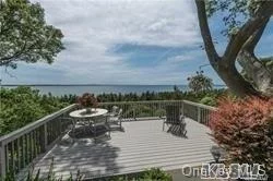 Spectacular Waterfront Residence Overlooking Smithtown Bay And The LI Sound With 160FT Of Water Frontage. Many Updates Including A Gourmet Modern Kitchen With Every Amenity, Family Room With Fireplace And Walls Of Windows, Formal Dining Room, 5 BR, 4.5 Baths, Upstairs Den With Deck, Sunroom, Large Master BR Suite. Steps Down To Beach, Very Private And On Cul-De-Sac. Perfect For Year Round Resident Or Summer/Weekend Home. Access To Private Crane Neck Beach. Incredible Sunsets Can Be Yours!