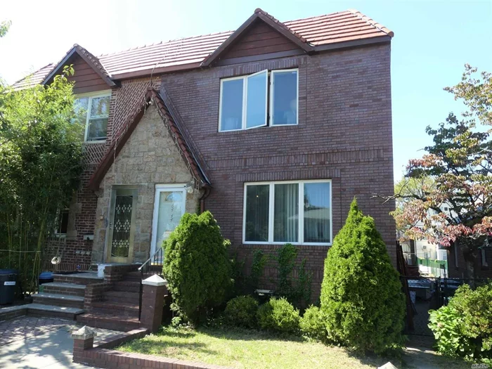 Middle Village North: Welcome home to this spacious 54 foot long brick semi-detached 2 family home!  Featuring a 2 car garage, a roomy patio, and oak floors, this is a listing you don&rsquo;t want to pass up. Move-in condition and zoned for highly desirable PS 49.---