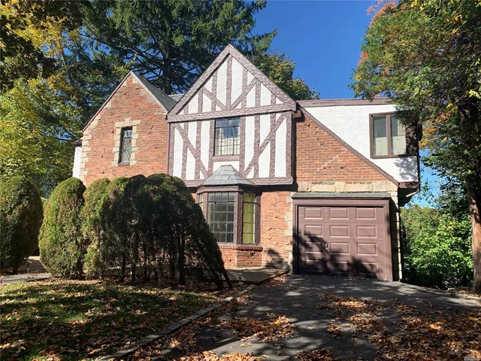 Classic South Strathmore Tudor.Oversized Bedrooms and Ground level Basement.Low Taxes.Award winning Manhasset Schools.