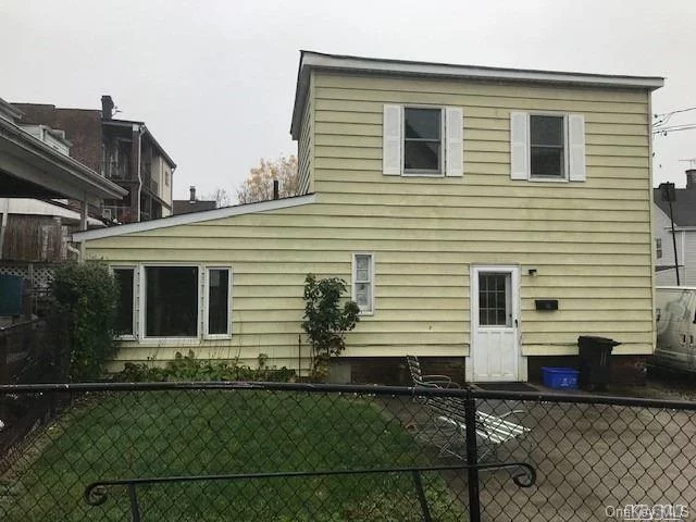 Ready to move in clean home with wood floors. Nice size kitchen and living room. 1 bedroom is a little small and the 2nd bedroom is long and a little narrow, nice size closets. W/D hookup is on the first floor. Privacy of being in your own home. Front patio.