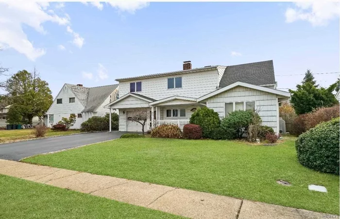 HIGHLY DESIRABLE, MODERN HOME IN THE W SECTION OF WANTAGH, GREAT FLOOR PLAN WITH DEN WITH A FIREPLACE, 4 BEDROOMS ON 2ND FLOOR, HOME IS GREAT FOR ENTERTAINING , LARGE ROOMS AND PLENTY OF CLOSETS, THERE IS ALSO A HALF GARAGE FOR STORAGE AND PRIVATE DRIVEWAY