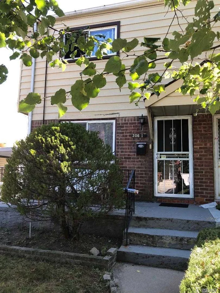 Semi Attached Colonial In The Heart Of Bayside. House Has Nice Size Room - Enclosed Yard - Needs TLC - Near Bus, Highways & Stores.