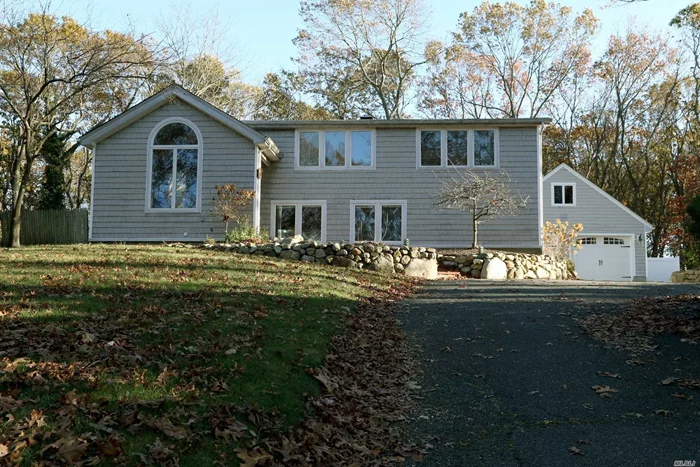 Custom Expanded Colonial with open, spacious, bright floor plan, Radiant heated floors in Kitchen and Ext Family Rm, Stone Fireplace, 200 Amp, 2.5 Det Garage w/Walk up Attic, Cac and Elec updated 2017, Roof approx 3 1/2 yrs old, Private yard with Paver Patio and Pergola, Three Village SD
