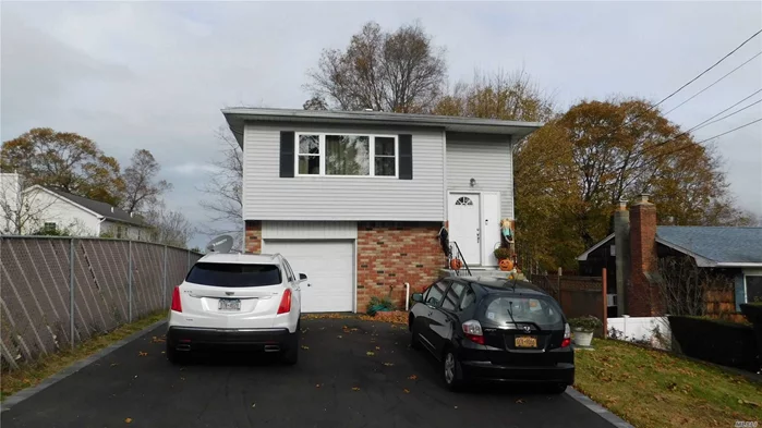 Nicely Updated Home with Winter water views of Lake Ronkonkoma, Wood floors, New Windows, Kitchen, Bath and Driveway...