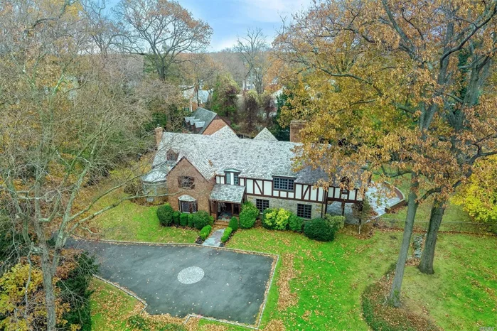 Entertaining flows from the grand principal rooms to the bluestone patio overlooking spacious yard. Updated & renovated, this designer-style home on 1 acre features a formal LR w/fp, FDR, library w/fp, sunlit den, gourmet EIK & conservatory on main flr. Upstairs is a luxurious master suite w/bath & balcony, 4 addtl. BRS, 3 full baths + guest suite w/bth. A gym, 2nd fam Rm & laundry on lower level.