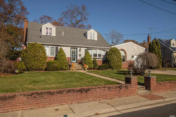 Super Expanded cape w/space For Mom in the very desirable Poet section of North Babylon. 5 large Bedrooms, Updated Kitchen with all new stainless appliances w/ gas stove , Updated Baths, Hardwood floors, gas fireplace, full finished basement, new roof, slim unit A/C. Must See!!