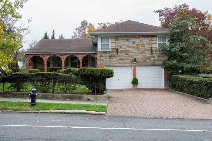 This beautiful solid Split Level 4 home sits on a corner lot (75 x 100). 4 BR/3BA. Master Bedroom has Master bath. Family Room with fireplace that leads to 2 car garage. Front Porch and Backyard Patio. Pristine landscaping. Surrounded by wrought iron fence. Great location. Close to all. Must See!!!