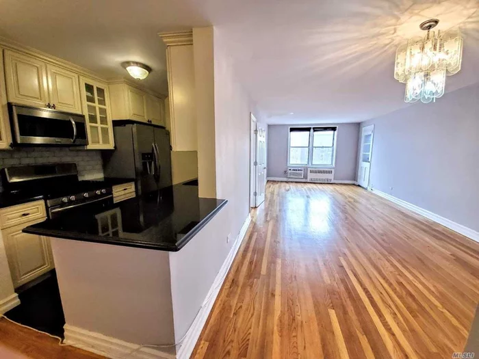 Top Floor 2 Bedroom Coop With Balcony and City Views! Updated Kitchen, Abundant Closet Space and Hardwood Floors Throughout. Unit Is in Great Condition and Centrally Located in Woodside in Well Maintained Building With Modernized Elevators, Laundry Room On Site, and Live In Super. Pet-Friendly and Can Sublet After 2 Years! Few blocks from R&M Train Station, Convenient Commute Into City. Close Proximity to #7 Train, LIRR And Buses.