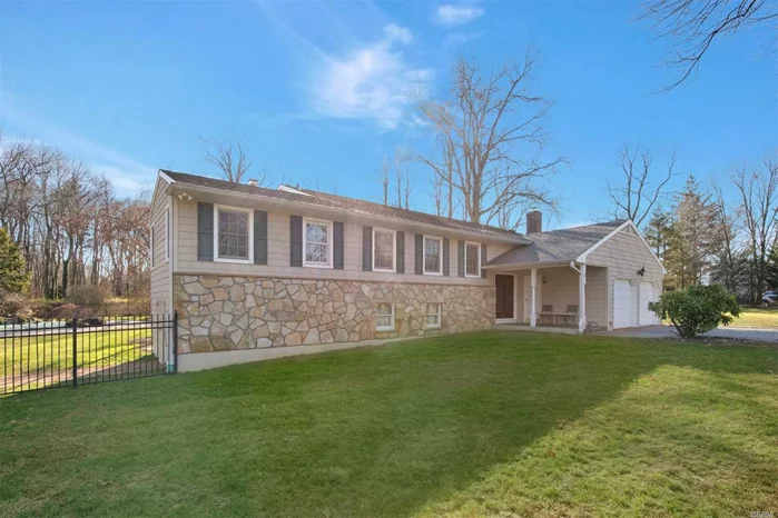 Split Level Expanded Ranch, 3000 sq ft of interior living space, Mstr bd w/ensuite, 3 bds, 2 full baths, EIK w/ceramic flooring, Living room & Lrg Dining Area w/vaulted ceiling, sunroom with heated parquet flooring, fireplace & wetbar.