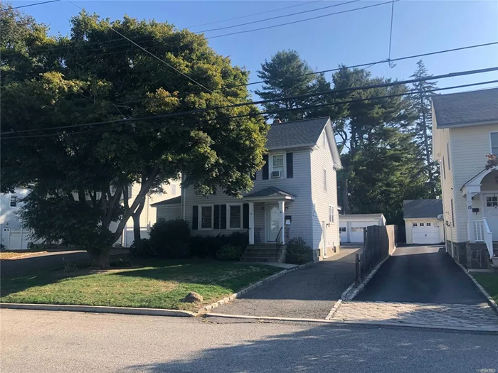 Amazing 2 family Colonial. Desirable Mid-block location. Both apartments have extra storage space. Attic/Basement. Downstairs apartment has been totally renovated. Separate rentable 2 Car Garage, Lovely flat property, mature trees, large driveway, plenty of parking.