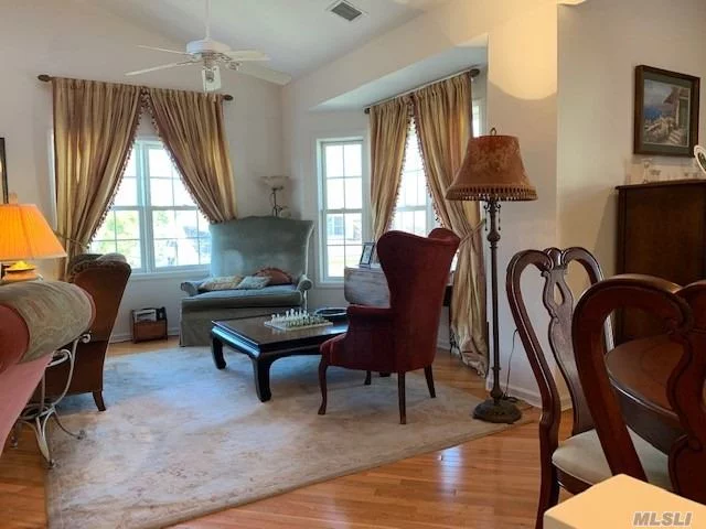 Beautiful, Bright, Sunny & Open Second Floor End Unit w/Vaulted Skylight Ceilings In Luxury Mill Pond Acres Gated Community for 55ys or Older, Private Entry, LR w/Dining Area, Office, EIK, Mastr Bedrm w/Mstr Bth, Bedrm w/Sliding French Doors to Terrace, Bthrm, Laundry, Lots of Storage Closets, Wood Floors, Community Clubhouse, Lrg Meeting Rm, Card Rm, Catering Kitchen, Indoor Pool, Tennis, Gym, Many Activities & Social Clubs, Shuttle Service to LIRR, Close To Shops, Restaurants, Parks & Waterfront