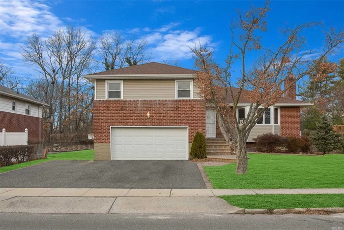 Well, Maintained Home Perfect Mid Block Location In Desirable Syosset Woods. Living Room Has Warming Brick Fireplace, Gorgeous Oak Wood Flrs Updated Window(5yrs), Updated Heating system(7yrs), Roof (5yrs), siding(3yrs), Bathrooms, Driveway and Brick walkway (6yrs) CAC was put in 5 yrs ago. Great Storage,