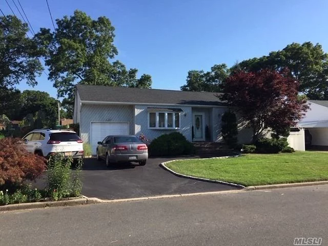 Spacious Custom Ranch in Excellent Condition. This Home Features 3 Bedrooms, 2 Full Baths, Large EIK w/ Sliding Doors to Huge Deck on Park Like Backyard, Dining Room, Huge Full Finished Basement w/ OSE. 1 Car Att Garage, Circular Driveway. 75 x 125 Lot. Low Taxes. Islip Schools.