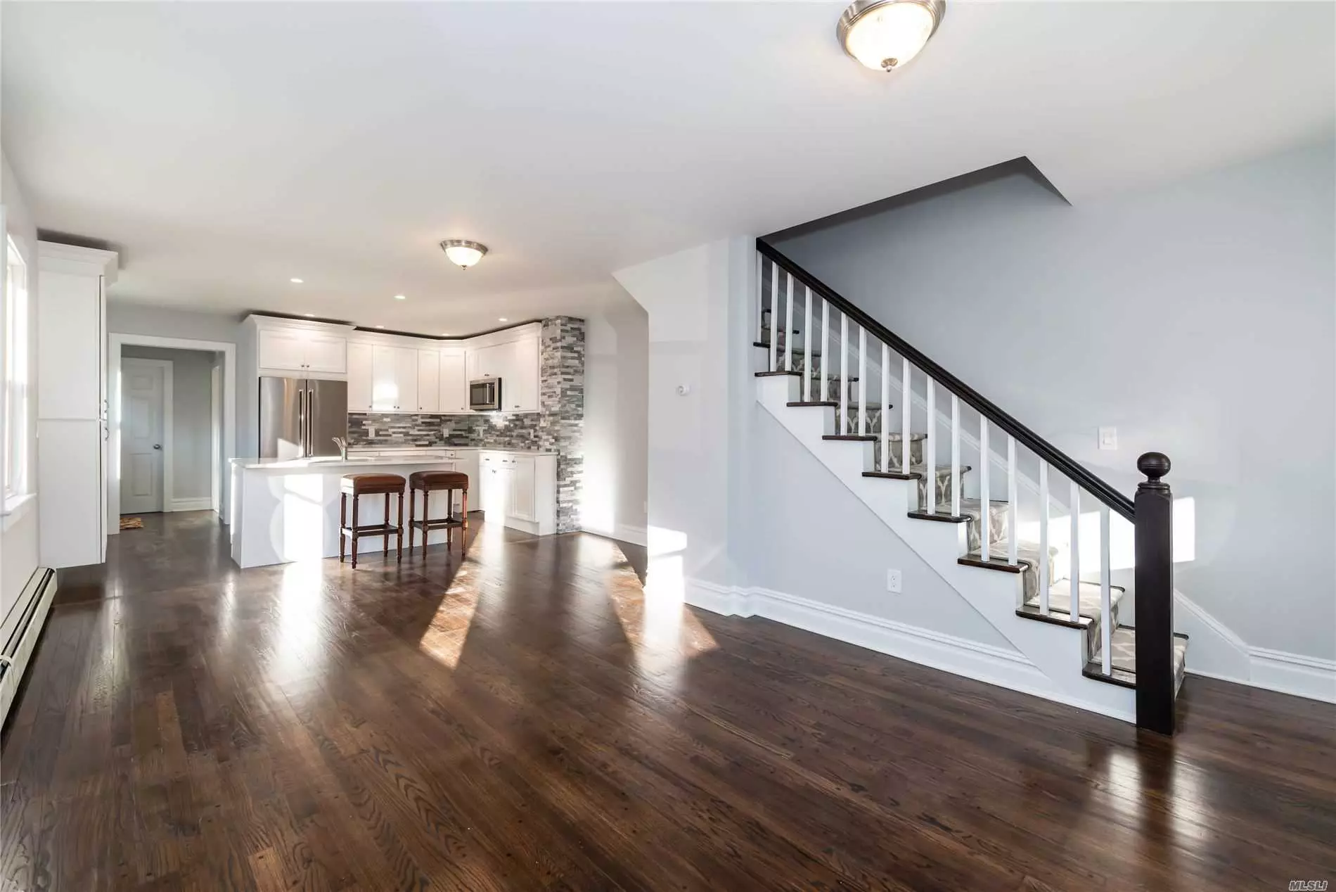 SIDE BY SIDE LARGE RENTAL. COMPLETELY RENVOATED! NEW EVERYTHING! RADIANT HEAT IN MASTER BATH, NEW APPLLIANCES, HARD WOOD FLOORS, WALK UP ATTIC AND LARGE BASEMENT WITH WASHER/DRIER, WINE COOLER AND SMALL EXTRA FREEZER..