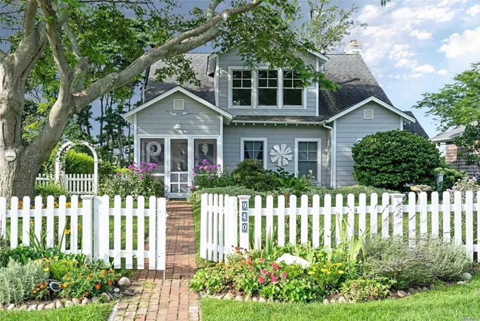 The picket fence and brick walkway leads you to this captivating waterfront retreat, right out of the pages of Coastal Living magazine. From the entry porch with english cutting gardens to the screened sleeping porch, covered waterside breakfast porch, the charm is in the details. The 2nd floor offers office space and ensuite master has tranquil views over the water. This coastal beach community is perfect for kayaking, days at the beach or lounging in the hammock. Offering includes 2 lots.