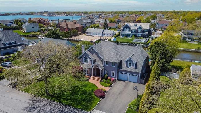 Nestled in West Islip&rsquo;s famed Magoun Landing Waterfront enclave sits this 5000 sq ft five bedroom, four and one half Bathroom Custom Colonial design featuring entertaining spaces to delight the entire family. Four fireplaces to warm you and your guests in the winter and an in-ground pool and outdoor kitchen patio overlooking wide waterway. Every amenity anticipated will surround you with comfort and elegance. Bring your Yacht and jet-skis to safely dock four homes off the Great South Bay.