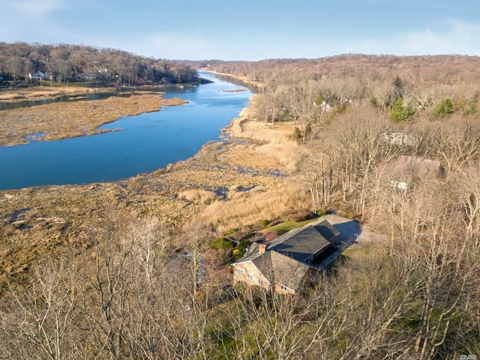 Waterfront Ranch! This Waterfront Residence Sits On Over 2 Acres of Secluded Property With Stunning Year-Round Panoramic Views of Scenic Nissequogue River. Classic Floorplan W/ Granite Kitchen, Formal Dining Room, Sitting Room, Great Room W/ Vaulted Ceilings - All Have Clear Views To The Water With Bright Sunlight Flowing Through. 2 Master BR Suites, New Hardwood Floors, Updated Bathrooms, Lower Level Walk-Out To Pool, Finished Basement, IG Gunite Pool, Brick Paver Patio & Breathtaking Sunsets! This house is being sold AS IS!