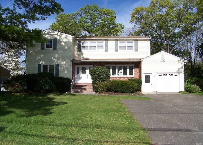 Beautiful Colonial, Settle on a Corner Lot, Featuring 4 Bedrooms, New Kitchen and Baths, Hardwood Floors, New Roof.
