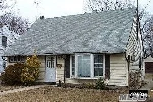 4 Bedrooms, 2 full baths, Great for M/D with proper permits.Needs TLC 195 foot deep property , Det 2 car gar. Short walk to shopping Village, RR, major arteries, and houses of worship.