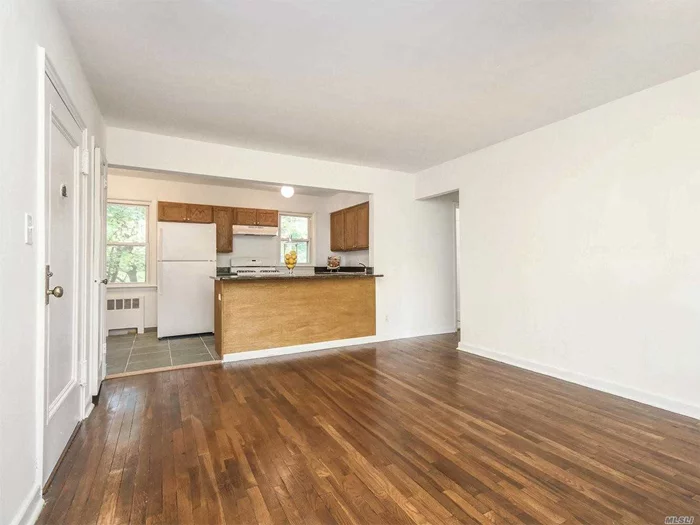 Beautiful sunlit unit located close to beaches and park. An open floor plan on the 2nd floor. Heat is included and there is a laundry room on the premises. Garage available to rent for $200 a month. Photos are not actual unit. Same floor plan.