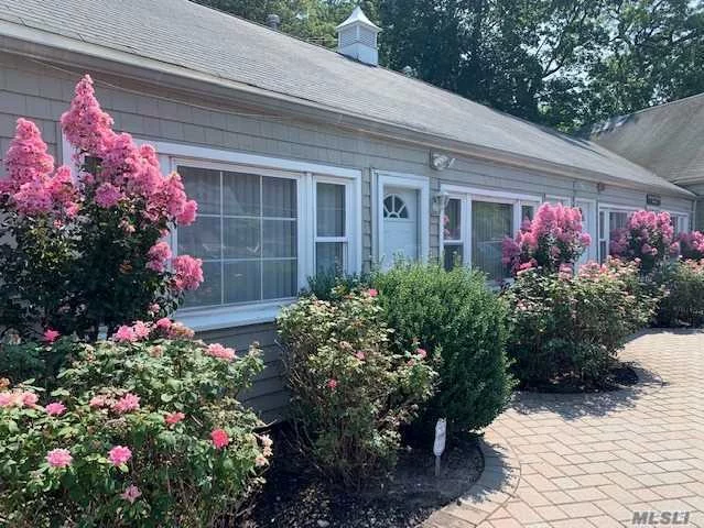 Sunny and bright suite available for professional use. 750 square feet inside with beautiful wood cabinets installed for storage. The property welcomes you with amazing landscaping outside. Corner Unit