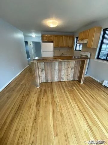 Beautiful Spacious Two Bedroom Apartment in Briarwood. Spacious Open Concept Kitchen/ Living Room with gorgeous new oak wood flooring. Great amount of closet space with well sized Bedrooms. Extra Storage Space with walk in closet!! EXCELLENT LOCATION! With 4 blocks from train, and short distance to LIRR. VERY EASY transit commute to Manhattan, approximately 25 minutes. Less than 3/4 mile to all major highways and the JFK airport 10 minutes away. Close to all amenities!