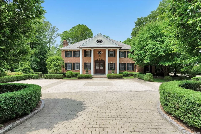 Elegant 5 bedroom Brick CH Colonial begins at the impressive entry foyer leading to stunning entertaining spaces with approx 5400 sq ft of luxury on 1 acre of lush property in Flower Hill. Stylish & spacious Entertaining rooms include LR w fpl, Gourmet Rutt kitchen w large center island , two dishwashers, walk in pantry,  sun filled breakfast room which overlooks the tranquil property,  patio & organic gardens,  The kitchen flows into a large Family Room w limestone fireplace, Formal Dining Room , den/office , An impressive & Grand Master Suite with fireplace, spa like master bath ,  walk in closets & Sitting Rm/Office/Nursery will be a favorite.  Beautiful architectural details & design make this home truly exceptional in every way & one not to be missed.