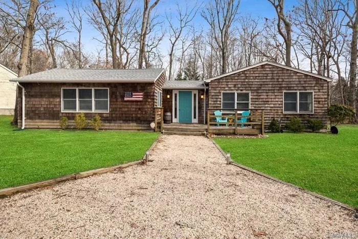 Beach House on Paradise Shores road with deeded bay beach rights at the end of the street. This cedar shake shingle ranch offers 3 Bedrooms, full bathroom, 1/2 bathroom, open floor plan in kitchen / living room/ dining area with cathedral ceiling, laundry room, and a cozy entrance foyer. Front and rear decks for entertaining. Brand new roof and flooring throughout. Home is in move in condition with a great location!