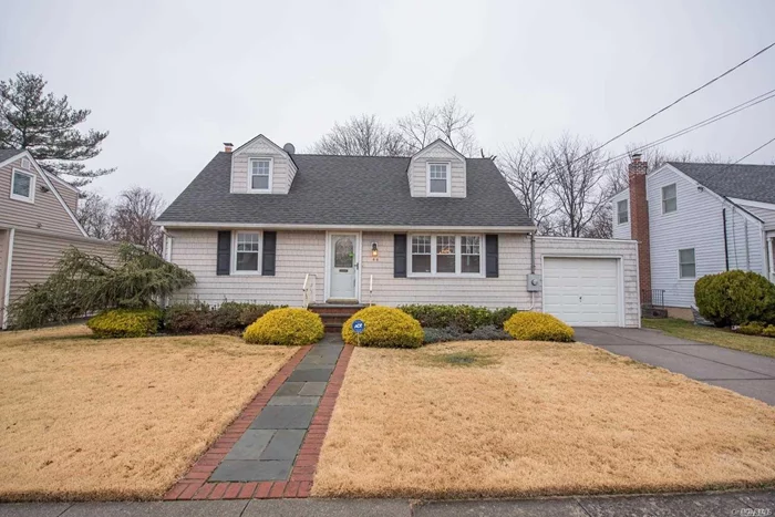 Location is Everything with this Expanded Cape Cod Home with Tons of Potential! Massive Unfinished Attic Area Upstairs Can Easily be Converted to Bedrooms or Masterbedroom Suite! Great Curb Appeal with Mid-Block Location! Refinish Everything to Suit Your Tastes! Updated Roof, Windows, and Siding! Weil Mclain Burner and 150 Amp Service!TAXES WITHOUT EXEMPTIONS ARE BELOW $9K!! **Not Representing Ductless A/C Unit** SOLD-AS-IS!