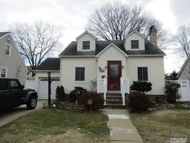 Charming Cape in a very convenient neighborhood!This home features an eat in kitchen, four bedrooms, a wood burning fireplace, att garage with new door. New front steps.In 2018 second floor is renovated with new walls with insulation, new electric, new doors in 2019, new Anderson windows, New Bathroom with fixtures, Brick BBQ in back yard. it is fully fenced In, Close to ground transportation and major highways. L I R R , walking distance to schools, library, super mkt, close Jones Beach.