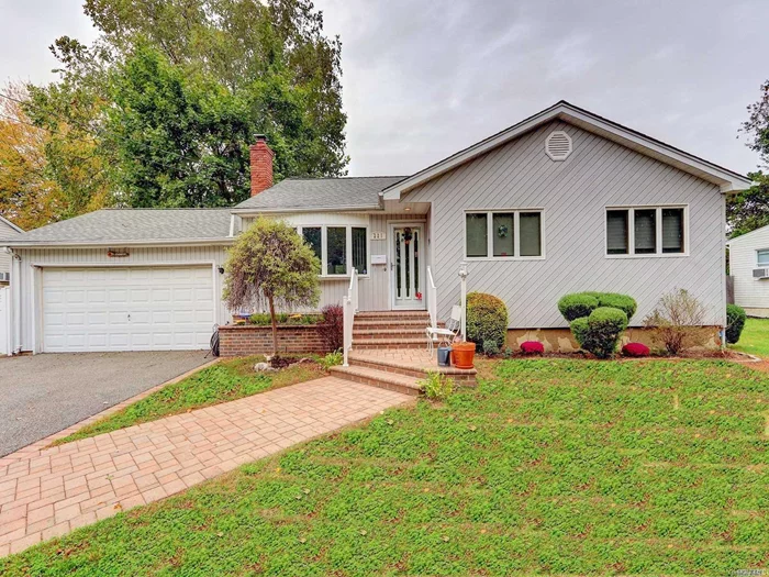 Updated kitchen with Corian counter and skylite, updated siding, windows, roof, heat system. Wood floors, Brick fireplace. Deck off Kitchen, IGS , CAC, full basement part finished