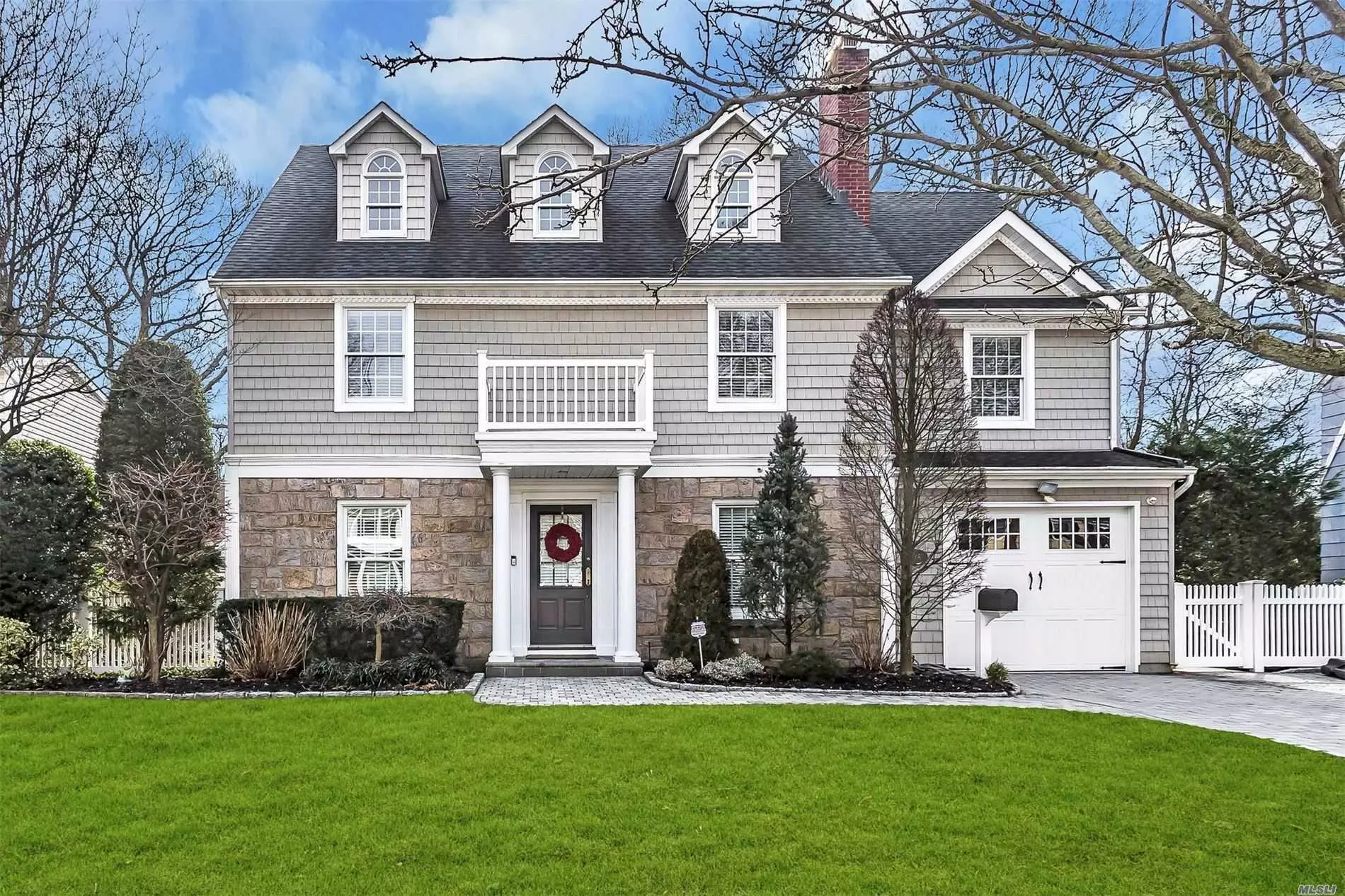 Heart of Merrick Woods! Stunning, Custom 4 bdrm 2 1/2 bth Colonial! State of the Art EIK, oversized center Island w/Calacatta Gold Marble, Wolf Stove, Sub Zero Fridge, wine fridge, Bosche Dishwasher, Formal DR w/gas frplace & built-ins, Den w/gas frplce, Crown Moldings, Hardwood Flrs. Master Suite w/separate office, Huge Master Bth, 3 bdrm, Full Bth, Radiant heat in upstairs baths, Storage Galore, Fin. Bsmt! Whole house water filtration, Close to LIRR, Approx. 40 min express to Penn!! Low Taxes!
