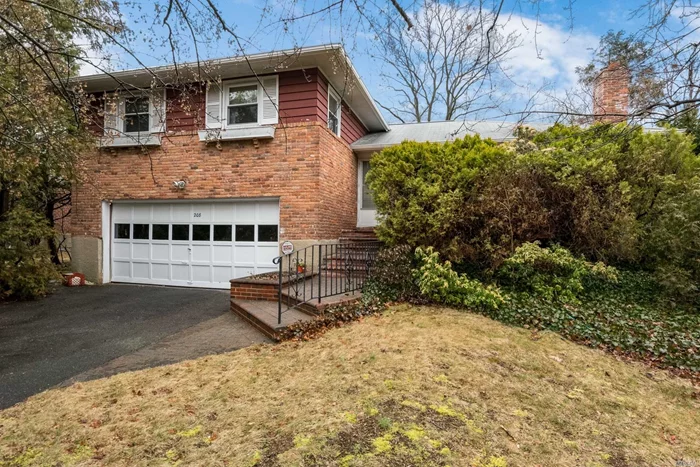 Opportunity Knocks! North Syosset, Expanded Huge 4 Bedroom and 2.5 Bathroom Split! Need update! Sold As Is! Gas Heating and Elec. Cooking. Close to Town and LIRR.