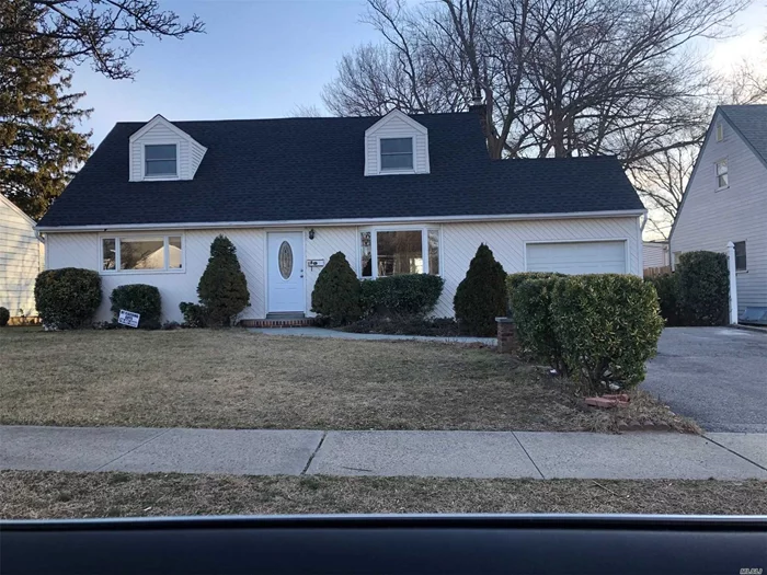 Beautifully maintained home with hardwood floors through out. Updated kitchen and baths. Funished basement with OSE. Large flat property. Brick patio. New roof and new boiler.