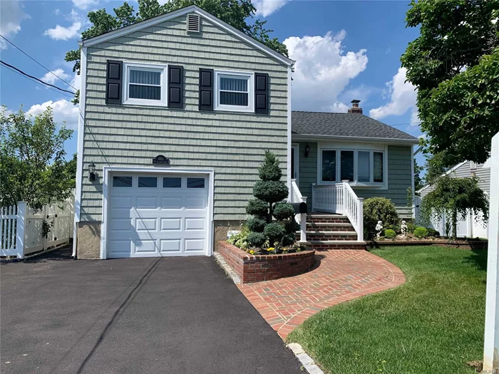 Updated Expanded Split in the heart of Plainedge School district! Mid block location! Updated Roof, Siding, CAC and Oil Heat. Good size bedrooms and 2 full baths. Hardwood floors throughout, OSE to Den. Room for everyone!! Large Backyard with Deck. Walking distance to the Elementary school and stores. Mother/Daughter potential. So many pluses!!