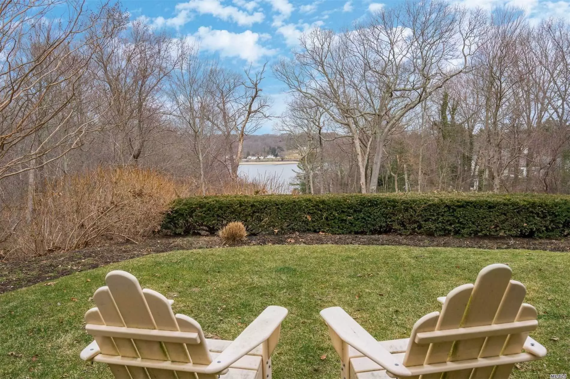 WATER VIEWS of CSH from this gracious Laurel Hollow Residence set on almost 2.6 beautiful acres! Enjoy views from Baronial Living Room w/over-sized custom fireplace, formal Dining Room, Den, Mudroom, Office, grand Kitchen and (deep) covered Porch.This gracious 5 Bedroom, 4.5 Bath residence was part of the DeForest Estate showcasing charming original details while thoughtfully expanded/equipped with modern day conveniences. Generator & Stove on propane, oil heat, CAC. Beach & Mooring.available. Taxes to DECREASE $7, 500 over 5yrs!Prequal req to show