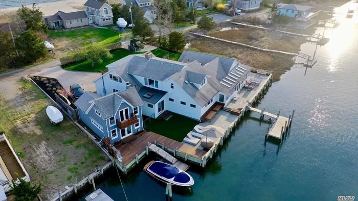Boater&rsquo;s paradise in Nassau Point. Oversized 5 bedroom 6 bath home with chef&rsquo;s kitchen in 4500 SF+ detached 800 sf 2 story boathouse. Amazing waterfront, beautiful sunsets, outside kitchen, Extensive decking, firepit, docking and much more. Ready for summer. Call for details.