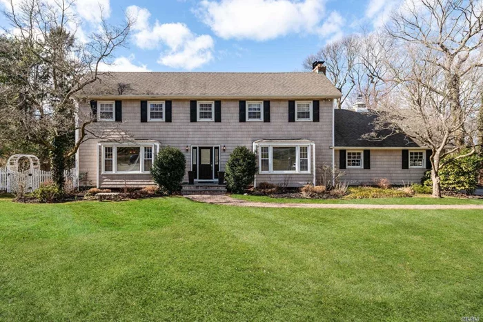 Colonial Residence set on 1.93 beautiful acres. Tailored with large principal rooms for entertaining, eat in kitchen, hardwood floors . Professionally landscaped property with inground pool . Quiet street , close to train and schools. Laurel Hollow Beach , CSH sd#2