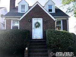 This Beautiful Brick Cape Offers FLR, Large EIK, 4 Bedrooms, 2 FBaths, Full Basement, Hardwood Floors Through Out, Det Garage. Potential Mother/Daiughter With Proper Permits