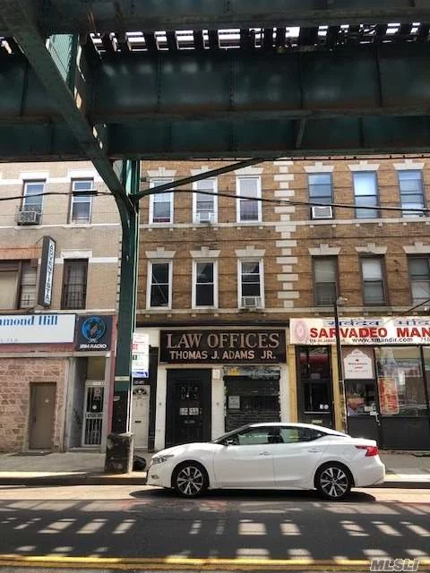 Great Investment. Store front perfect for professional with offices on the basement. 2 units upstairs each with tenants Nice size yard.