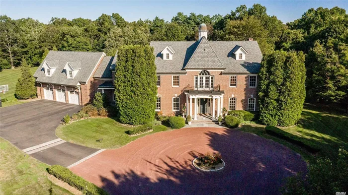 Magnificent Brick Colonial Designed by Bob Madey offers 7, 308 sq ft expandable 2K. 10&rsquo; ceilings 1st & 2nd fl 11&rsquo; basement w/OSE. Kitchen Susan Serra, Banquet FDR Coffered Ceilings Cherrywood 2 Home Offices 5 fireplaces 3 gas 1 wood 1 electric Smart Home Infrared Camera, Phast Electronic, Infinity Pool Waterfall Hot Tub English Garden Zoned Tennis Courts, Pool House, Barn, Corral access Horse Trail 22 pear trees line driveway. 2nd largest parcel Wheatley Farms, Low taxes quiet rear street. The seller accepts Bitcoin.