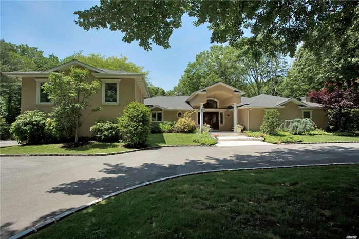 Beautiful Property Situated on 2 majestic Flat Acres of Landscaped Property in the heart of Laurel Hollow! This Sun filled home w/dramatic double entry foyer, and over sized circular driveway has a Spacious open floor plan for all your entertaining needs. Relax and enjoy large great room (20x20) as you view perfect acreage with tennis and room for pool.Fabulous custom Kitchen w/sunny breakfast area. In Addition, home offers a large office w/custom wood cabinets, large private guest suite bdr/bath and living room, Sonos system through out, IG Sprinklers. This property in Laurel Hollow comes w/PRIVATE Beach+mooring rights. Minutes to LIRR Whole Foods, and World class shopping! A True Hidden Gem!!!